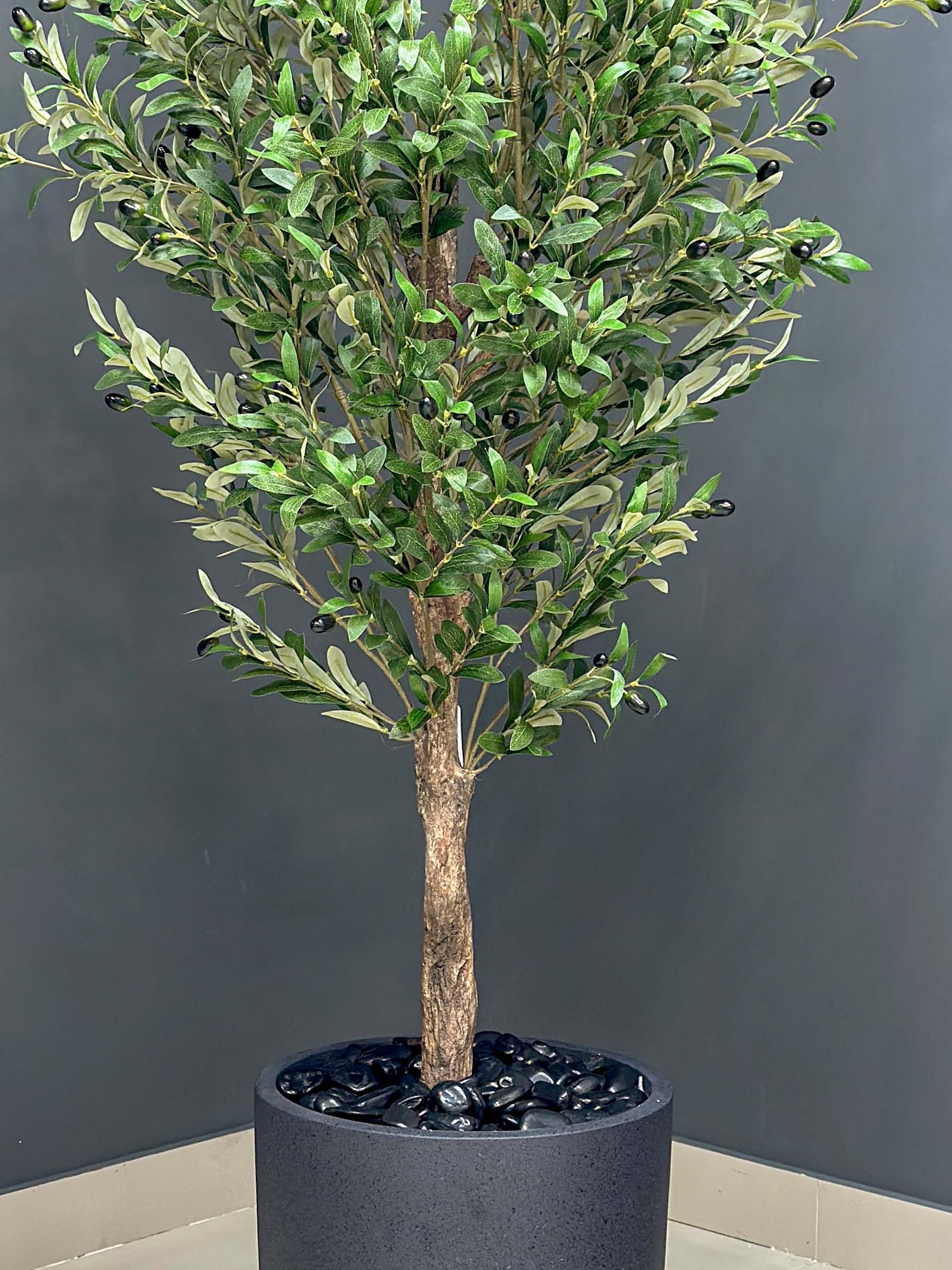 9132(2) Elevate your interior with our gorgeous Artificial Olive Tree. Enjoy the charm of nature in your home or workspace all year round!