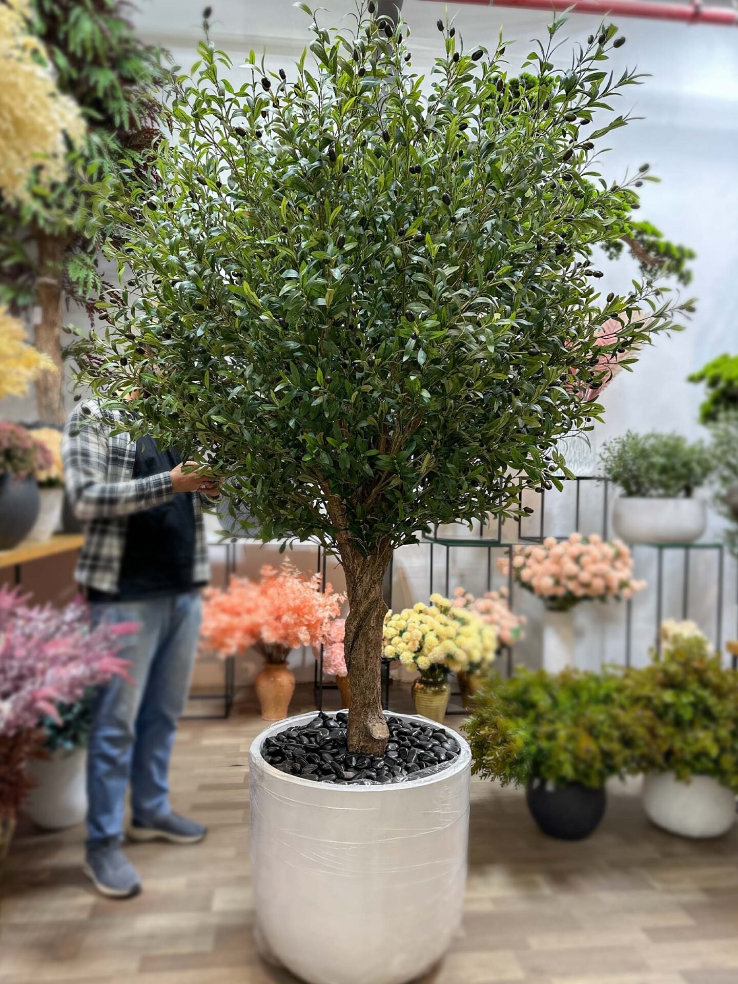 9264(1) Elevate your interior with our gorgeous Artificial Olive Tree. Enjoy the charm of nature in your home or workspace all year round!