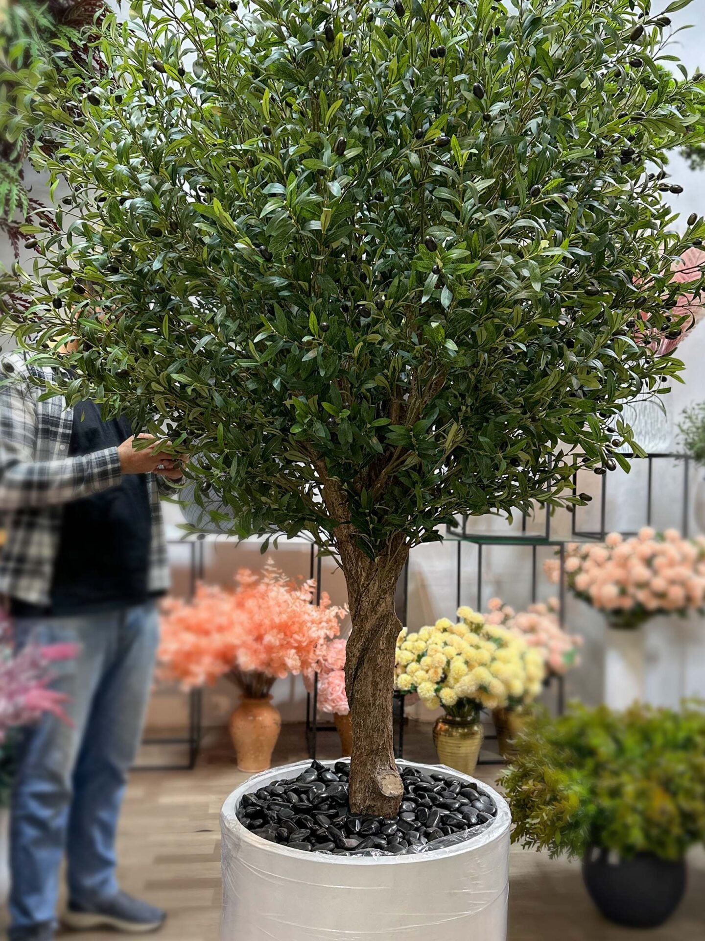 9264(2) Elevate your interior with our gorgeous Artificial Olive Tree. Enjoy the charm of nature in your home or workspace all year round!