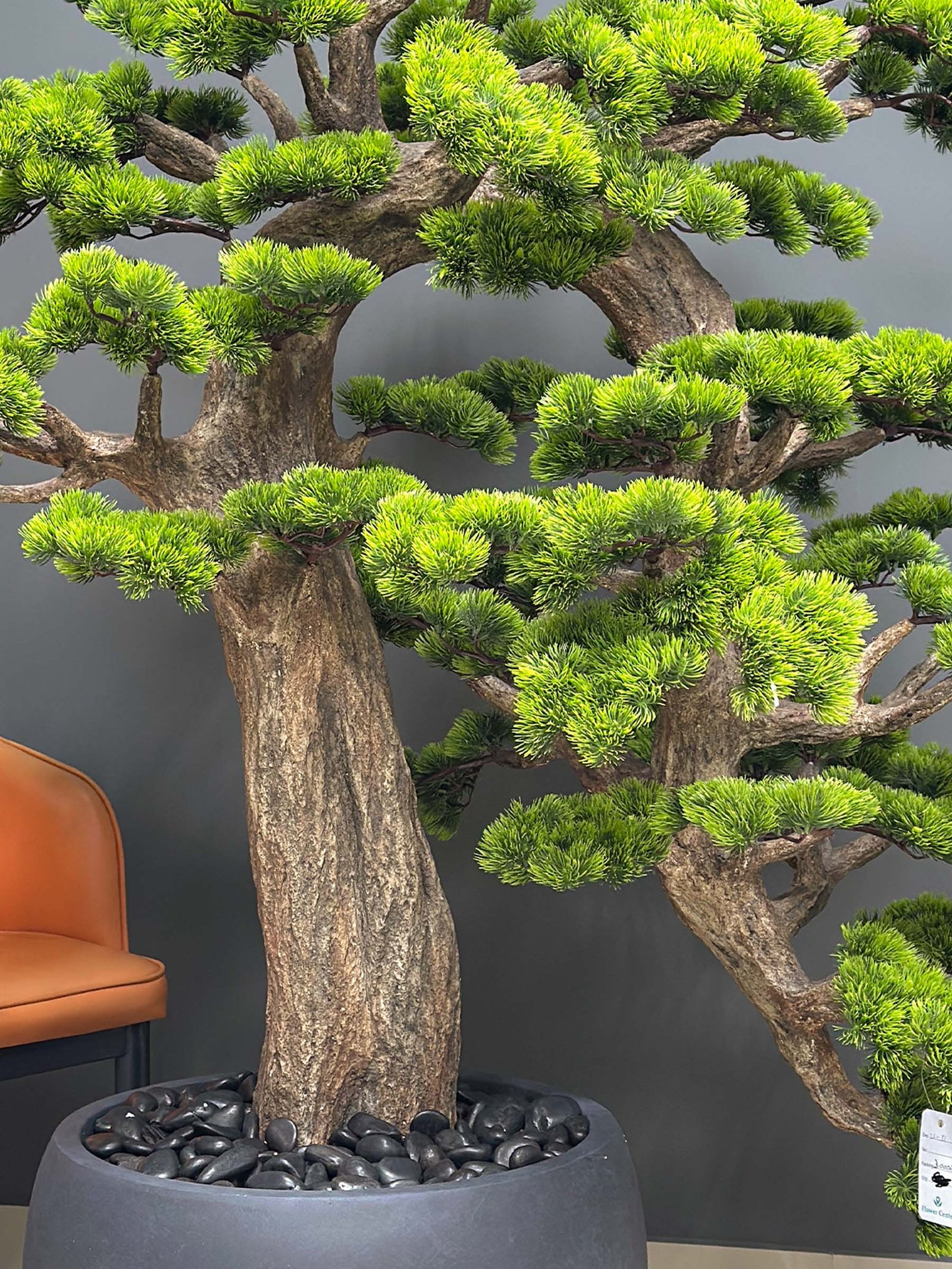 Elevate your space with this stunning Artificial Bonsai Tree! Its realistic design and stylish pot will bring everlasting beauty to any setting.