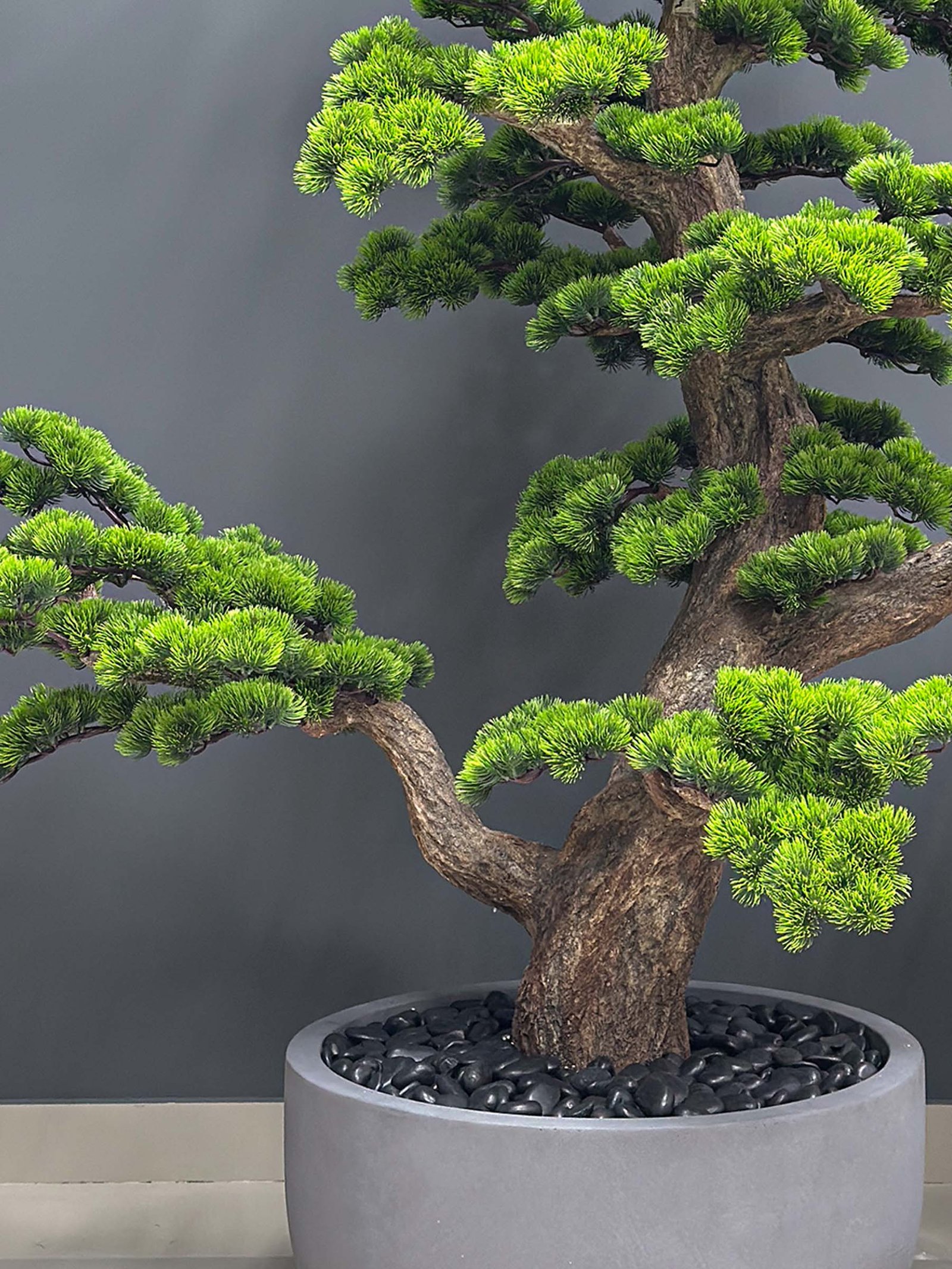 Elevate your space with this stunning Artificial Bonsai Tree! Its realistic design and stylish pot will bring everlasting beauty to any setting.
