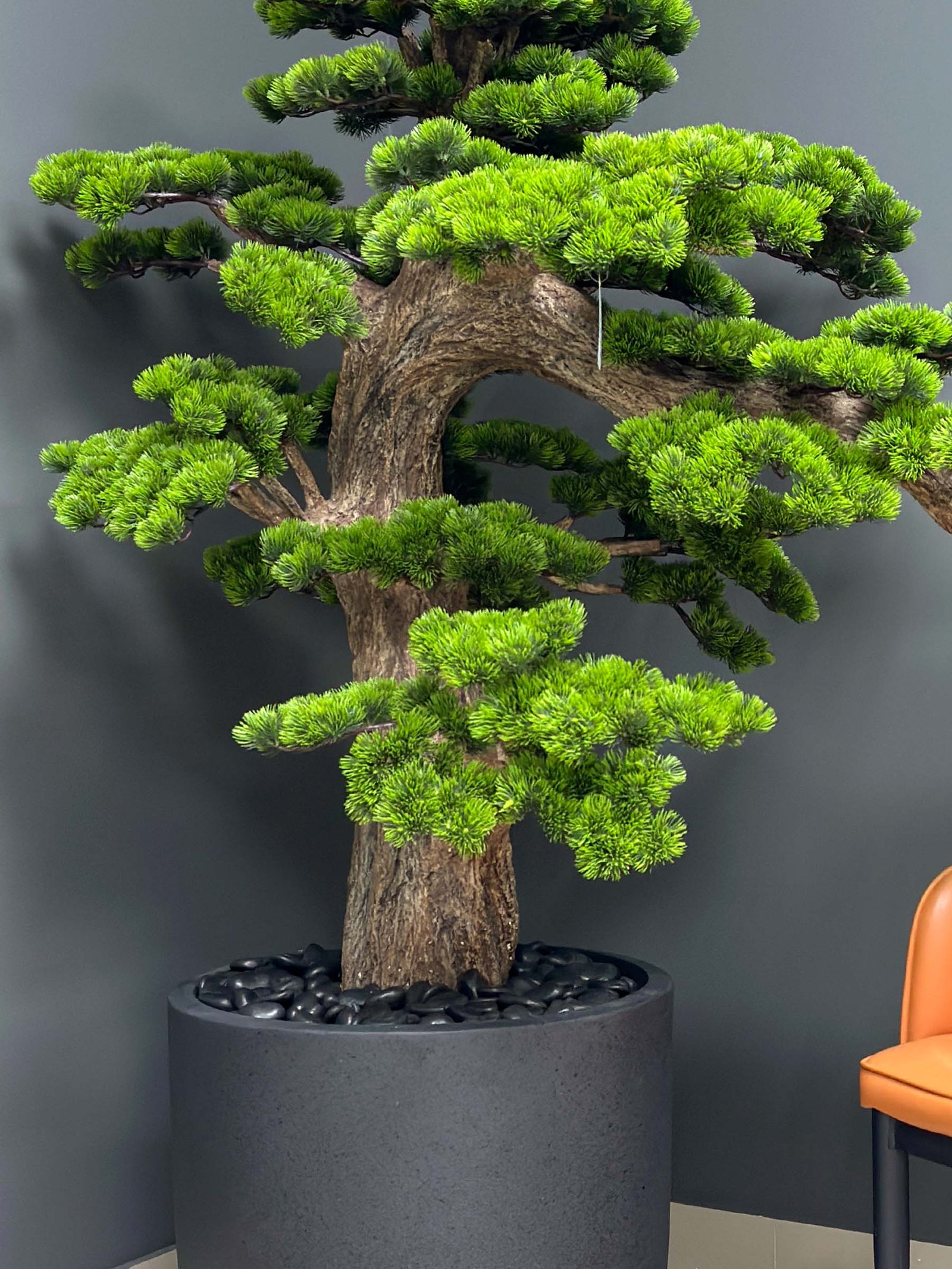 Elevate your space with this stunning Artificial Bonsai Tree! Its realistic design and stylish pot will bring everlasting beauty to any setting.