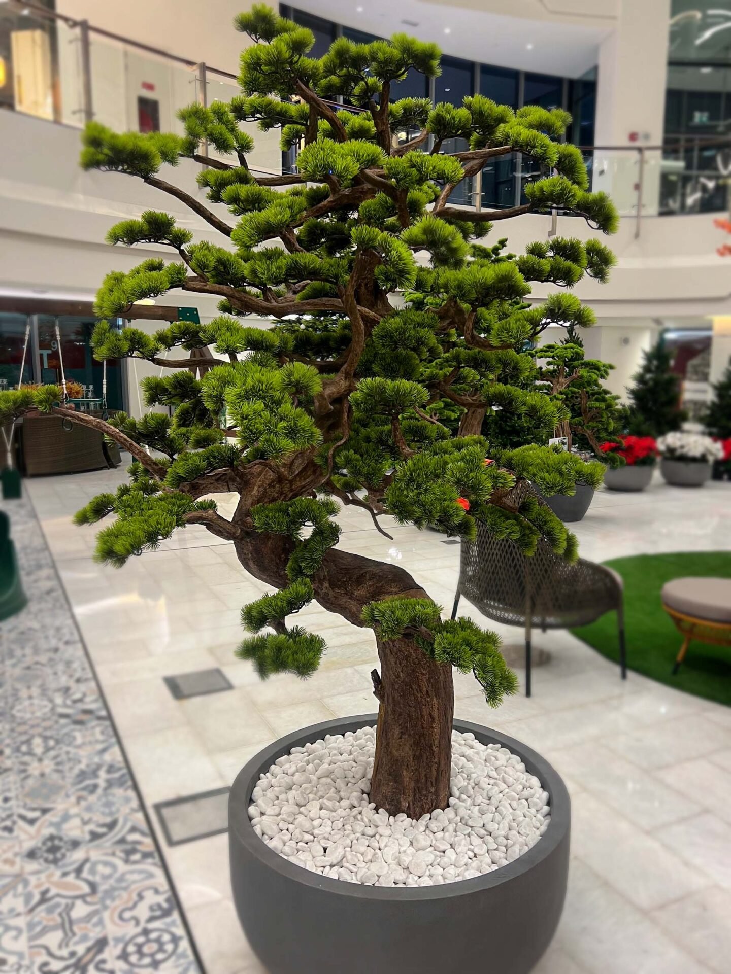 Elevate your space with this stunning Artificial Bonsai Tree! Its realistic design and stylish pot will bring everlasting beauty to any setting.