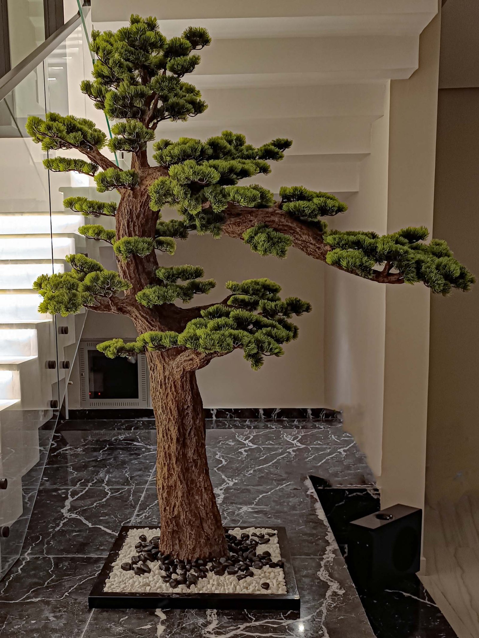 9660(1) Elevate your space with this stunning Artificial Bonsai Tree! Its realistic design and stylish pot will bring everlasting beauty to any setting.