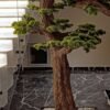 9660(2) Elevate your space with this stunning Artificial Bonsai Tree! Its realistic design and stylish pot will bring everlasting beauty to any setting.