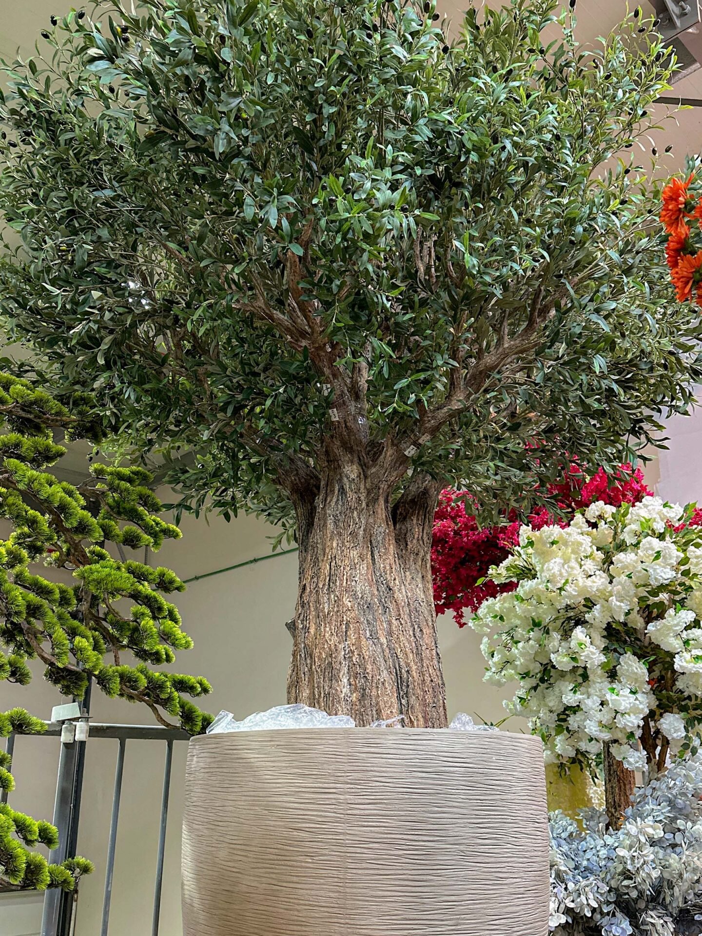 9717(2) Looking for lasting beauty? The Artificial Olive Tree adds flair to any environment, whether commercial or residential. Create your oasis today!