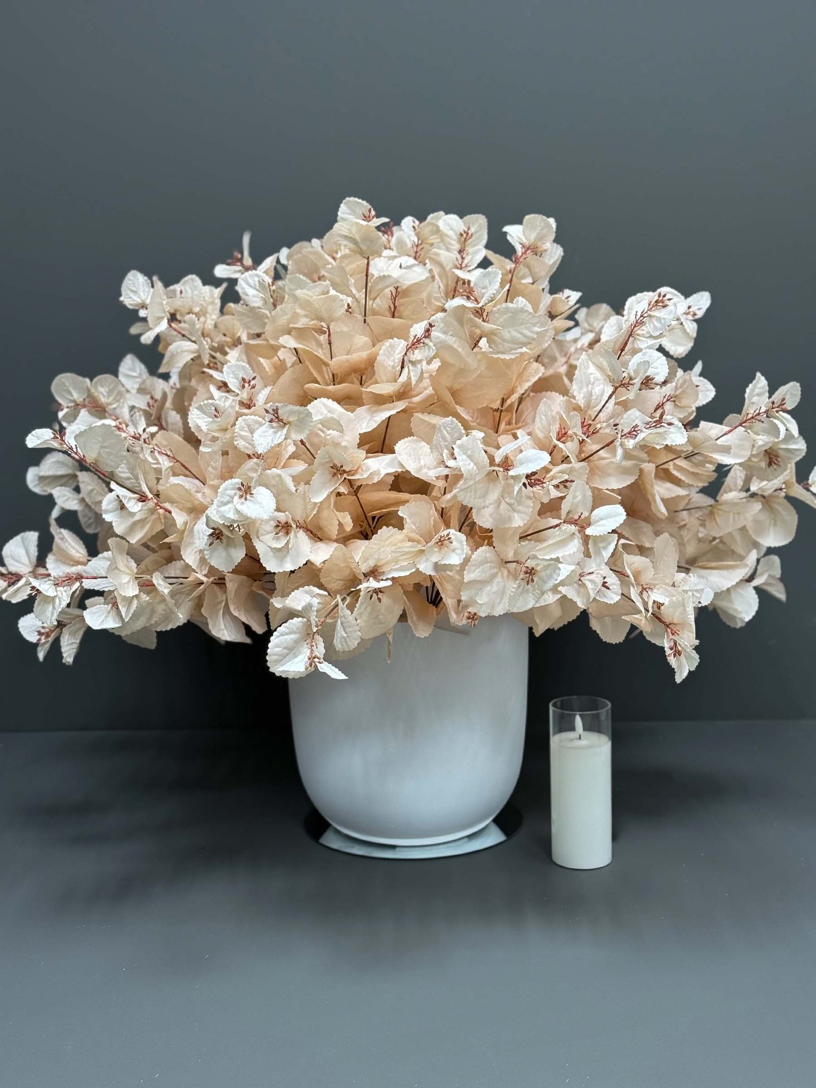 ar53 Add a touch of elegance to your space with the Artificial Accessories Golden - Grey Pot. Embrace everlasting beauty that requires no care!