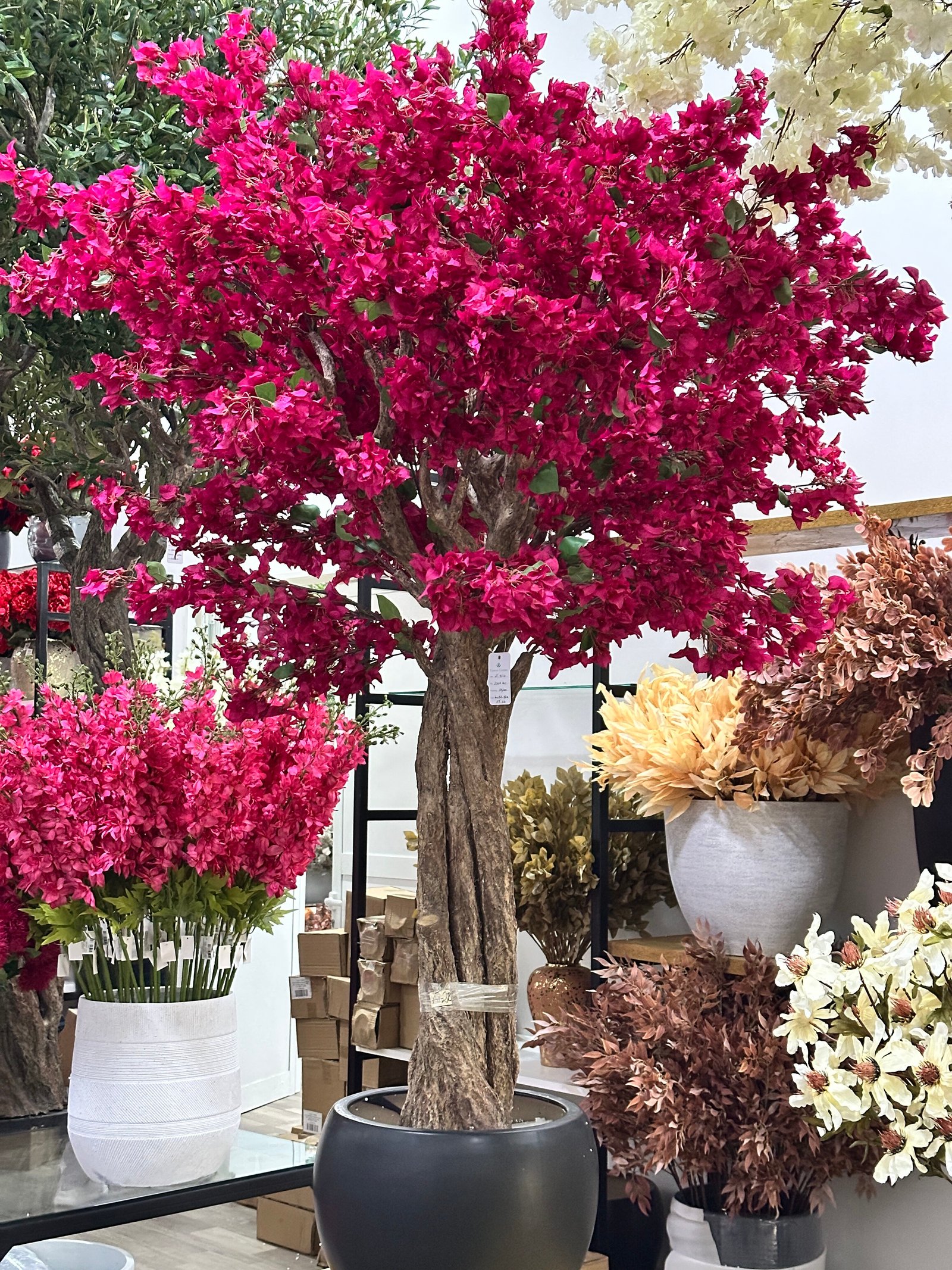 Artificial bougainvillea tree with pink flowers in decorative pot
